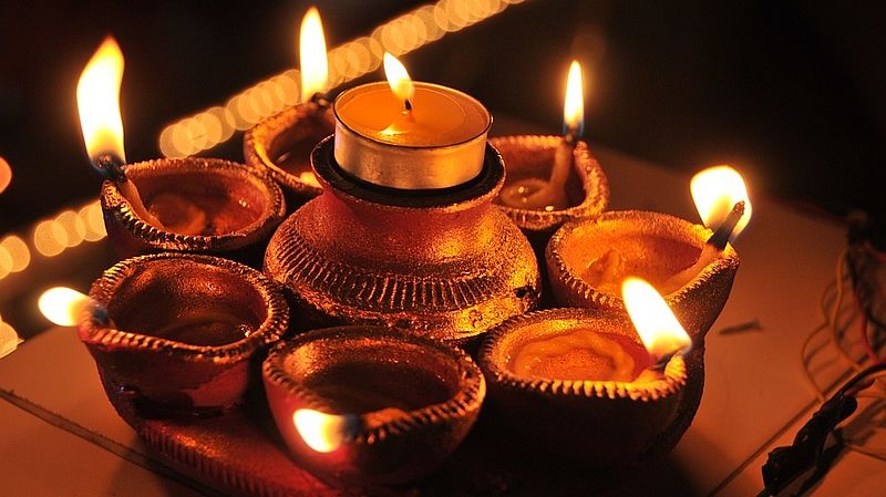 lit candles of a puja 