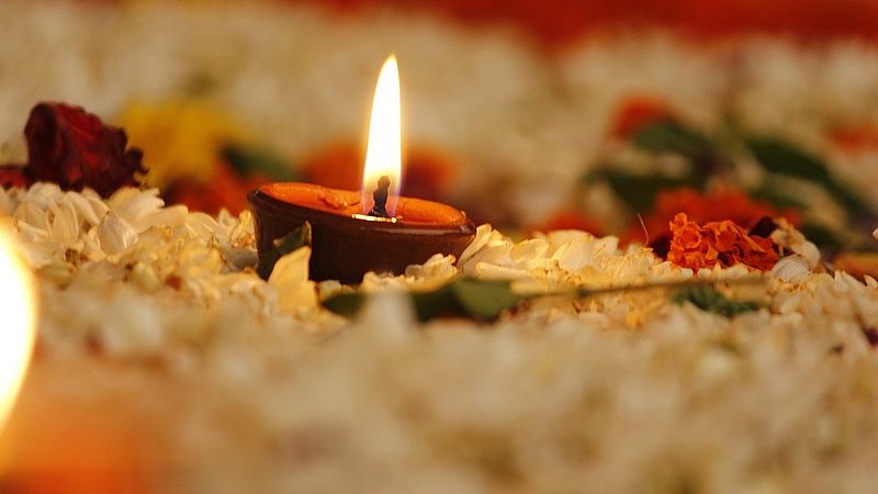 lit candle of a puja
