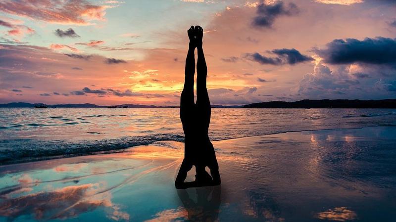 headstand on the beach